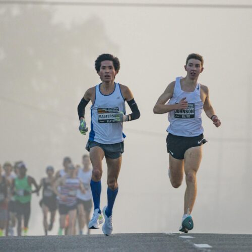 marathon runners in misty morning race